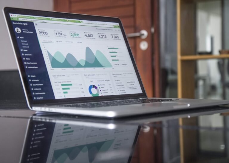 Laptop showing business growth charts