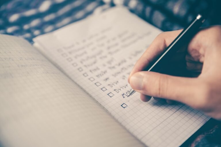 Weekly planner and budget tracker on a desk