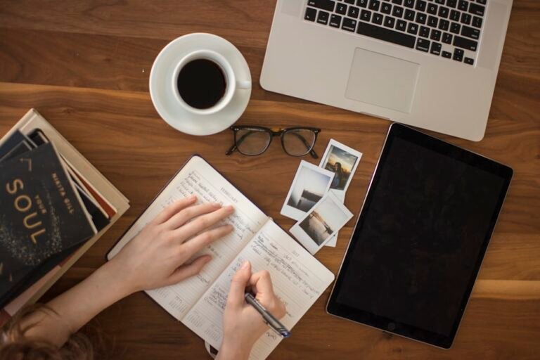 Desk with laptop and journal