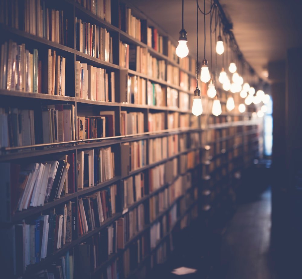 Warm library aisle filled with books