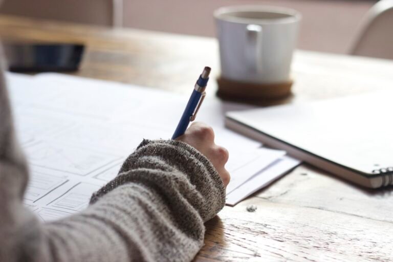 Handwritten study notes on a desk